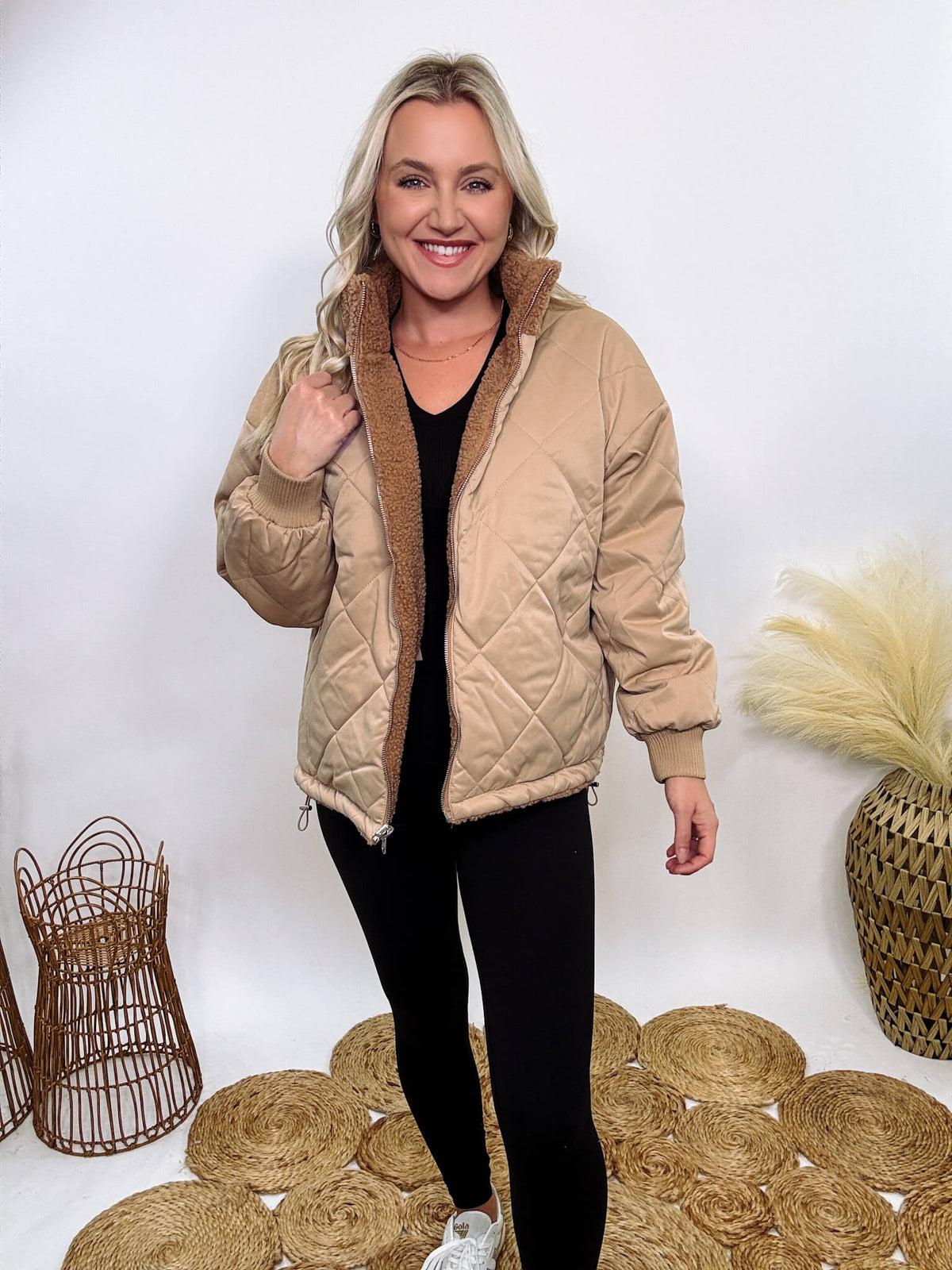 Hyfve - Embrace cozy style with our Reversible Sherpa Quilted Puffer Jacket in taupe camel. This warm, versatile jacket features a sherpa and quilted design, drop shoulders, and an adjustable waist toggle.