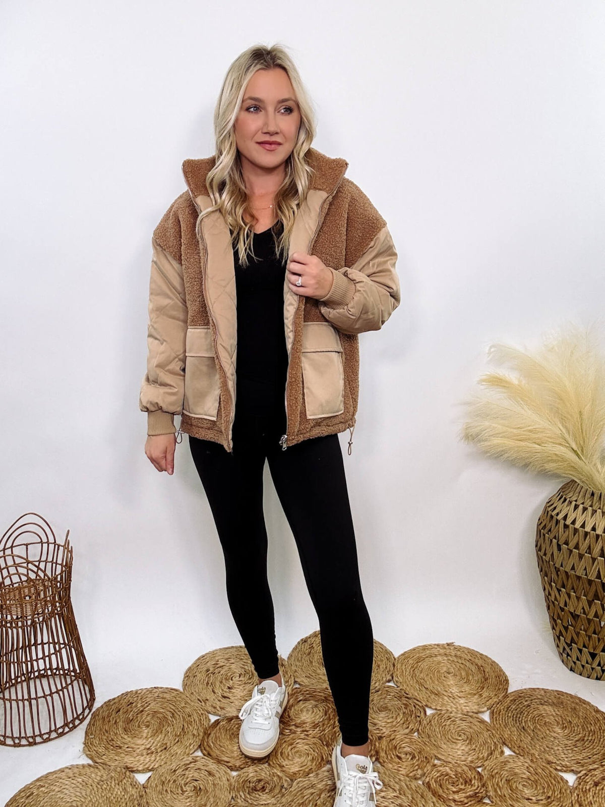 Hyfve - Embrace cozy style with our Reversible Sherpa Quilted Puffer Jacket in taupe camel. This warm, versatile jacket features a sherpa and quilted design, drop shoulders, and an adjustable waist toggle.