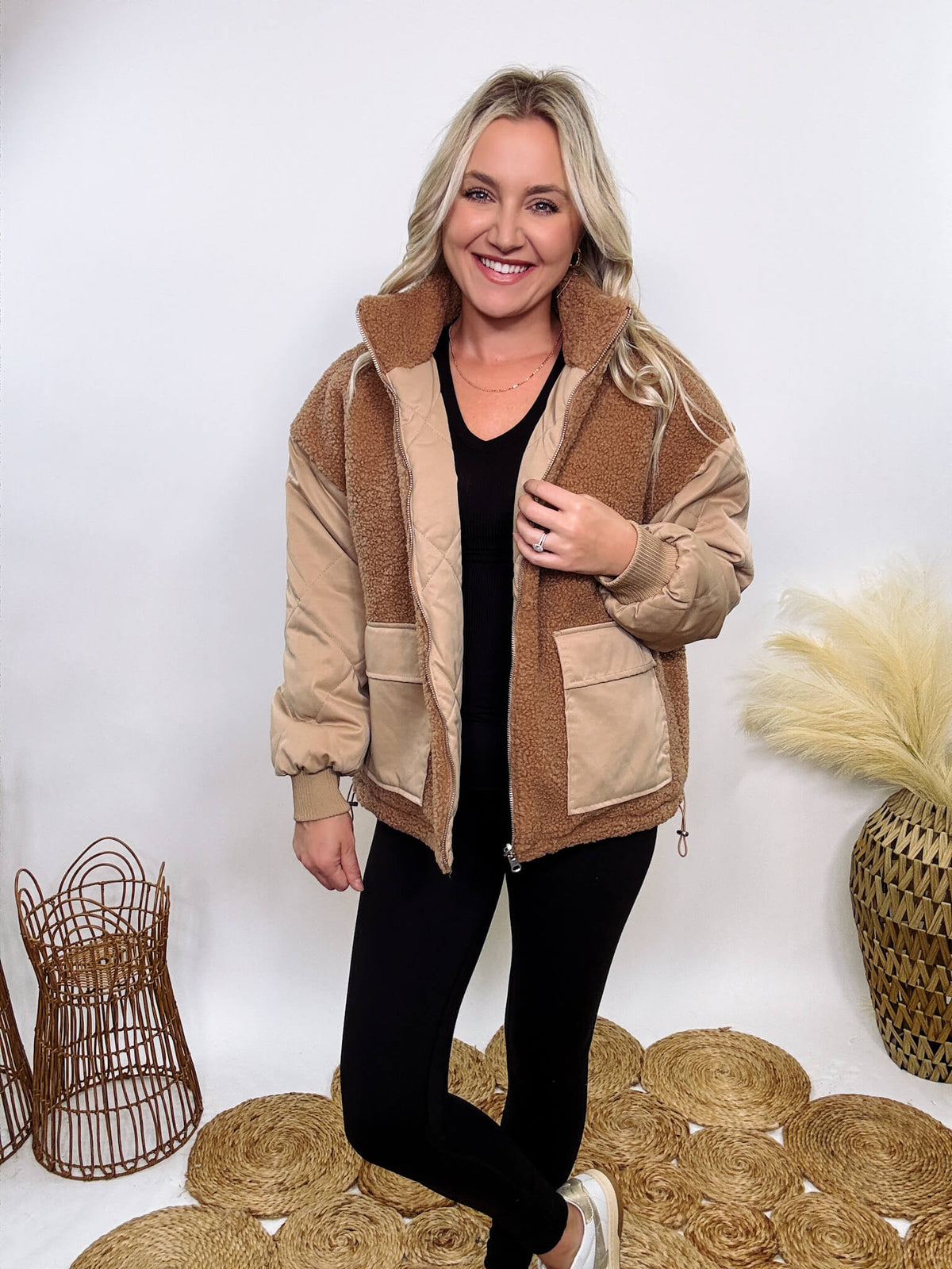 Hyfve - Embrace cozy style with our Reversible Sherpa Quilted Puffer Jacket in taupe camel. This warm, versatile jacket features a sherpa and quilted design, drop shoulders, and an adjustable waist toggle.