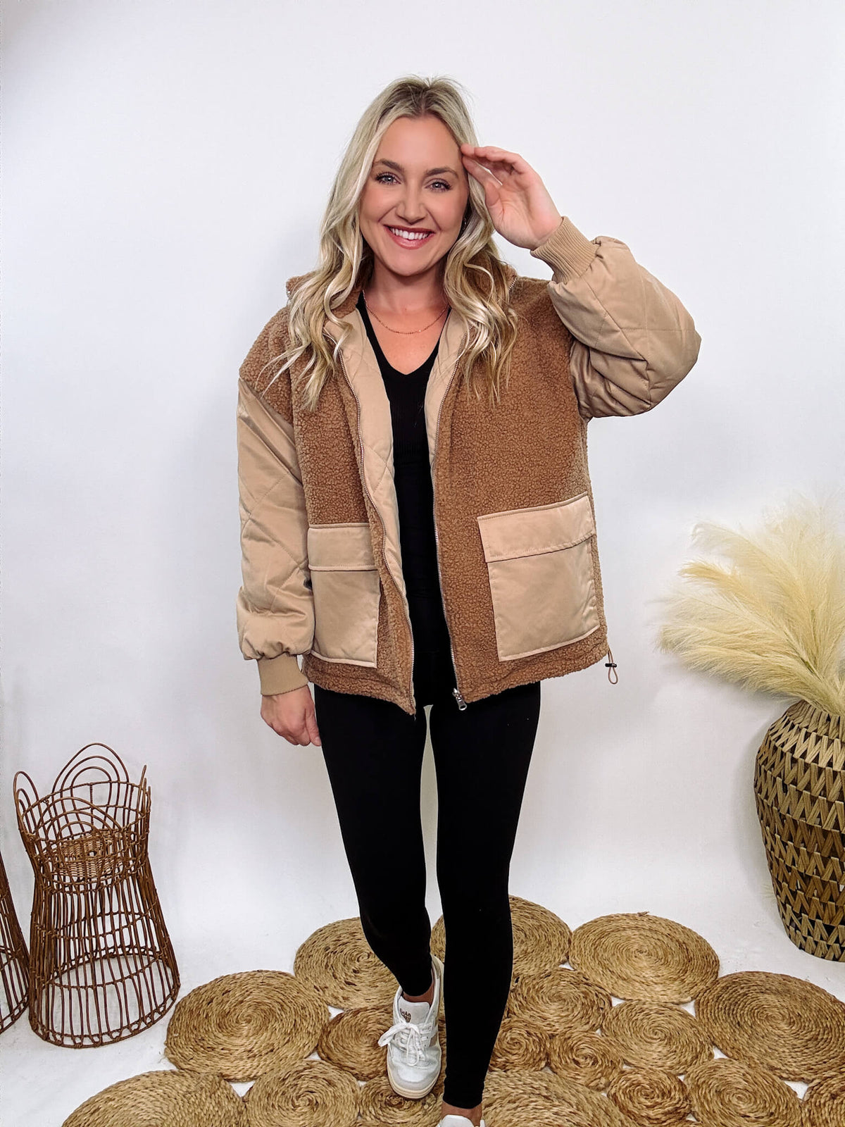 Hyfve - Embrace cozy style with our Reversible Sherpa Quilted Puffer Jacket in taupe camel. This warm, versatile jacket features a sherpa and quilted design, drop shoulders, and an adjustable waist toggle.