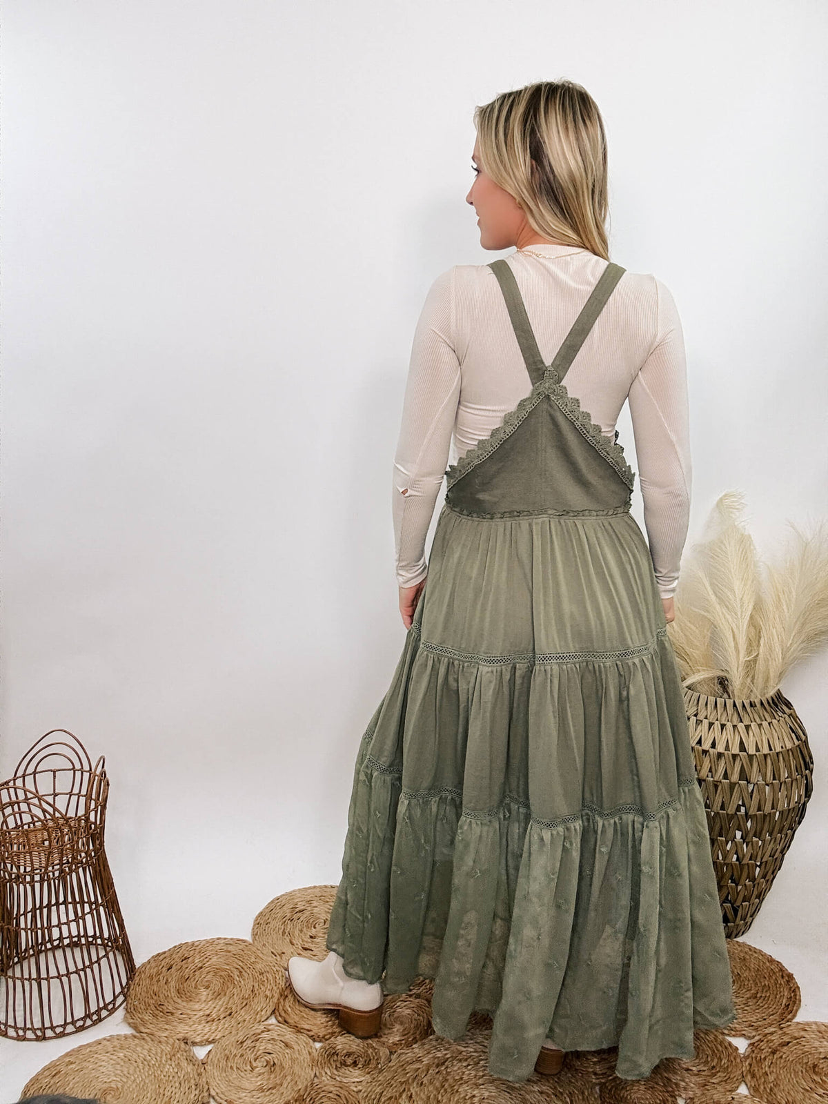 Boho olive green lace tiered overall maxi dress with adjustable straps, front chest pocket, and flowy silhouette