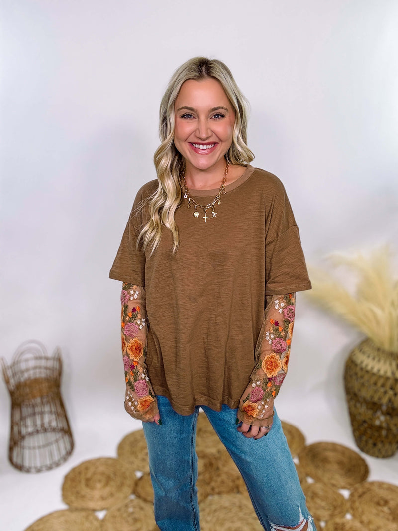 In Loom Mushroom Brown Oversized Tee with Layered Sheer Embroidered Floral Lace Mesh Sleeves – Relaxed Fit, Feminine Detailing, and Edgy Winter Style.