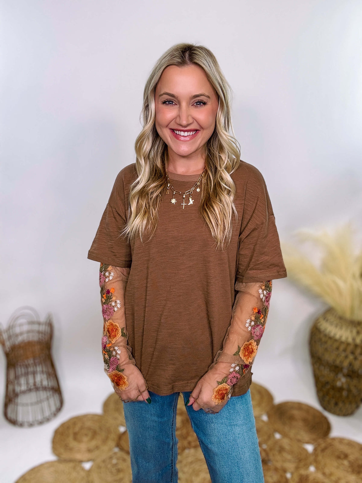 In Loom Mushroom Brown Oversized Tee with Layered Sheer Embroidered Floral Lace Mesh Sleeves – Relaxed Fit, Feminine Detailing, and Edgy Winter Style.