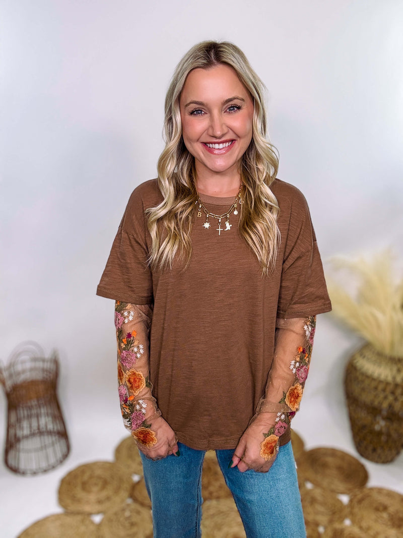 In Loom Mushroom Brown Oversized Tee with Layered Sheer Embroidered Floral Lace Mesh Sleeves – Relaxed Fit, Feminine Detailing, and Edgy Winter Style.