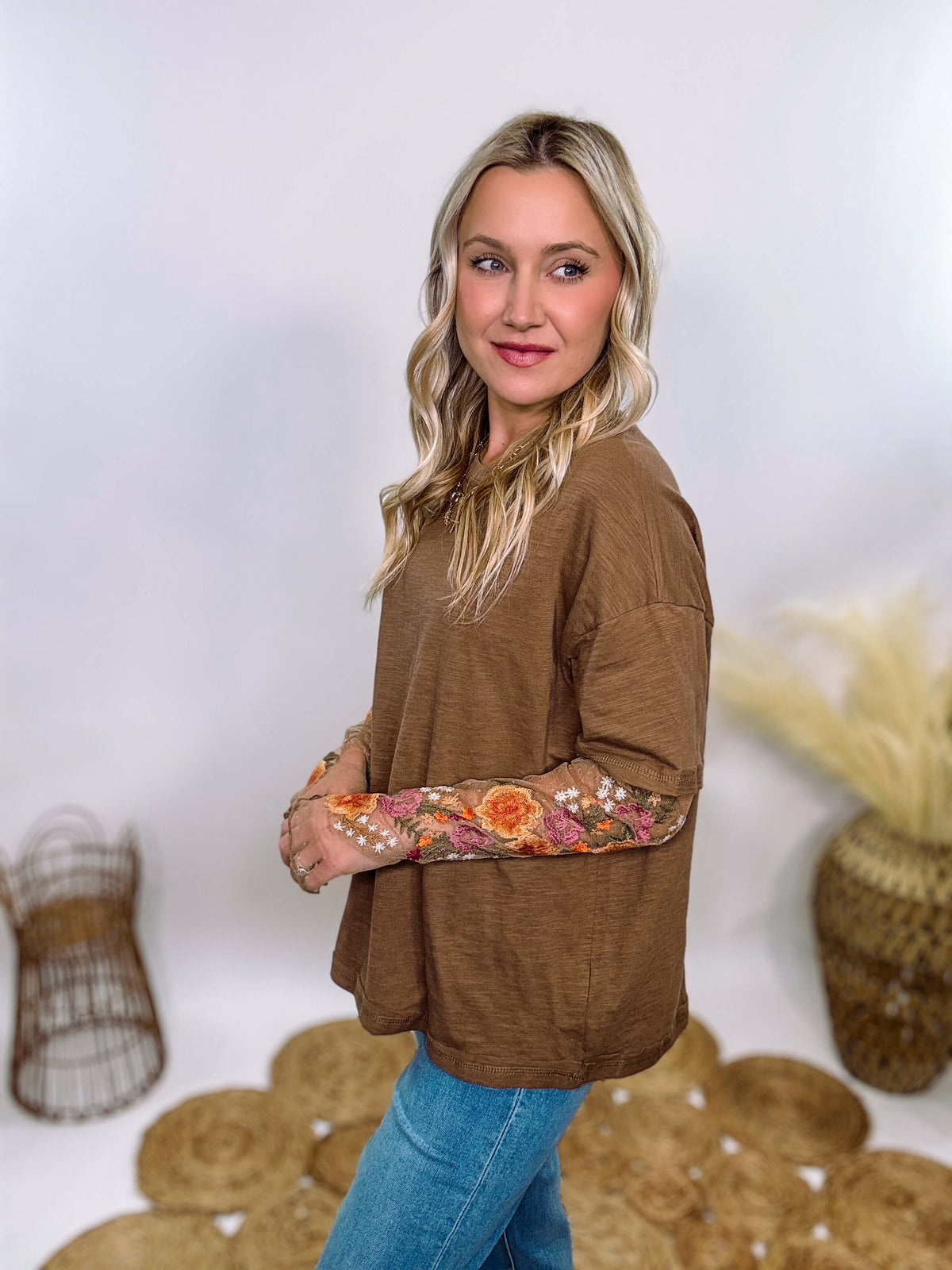 In Loom Mushroom Brown Oversized Tee with Layered Sheer Embroidered Floral Lace Mesh Sleeves – Relaxed Fit, Feminine Detailing, and Edgy Winter Style.