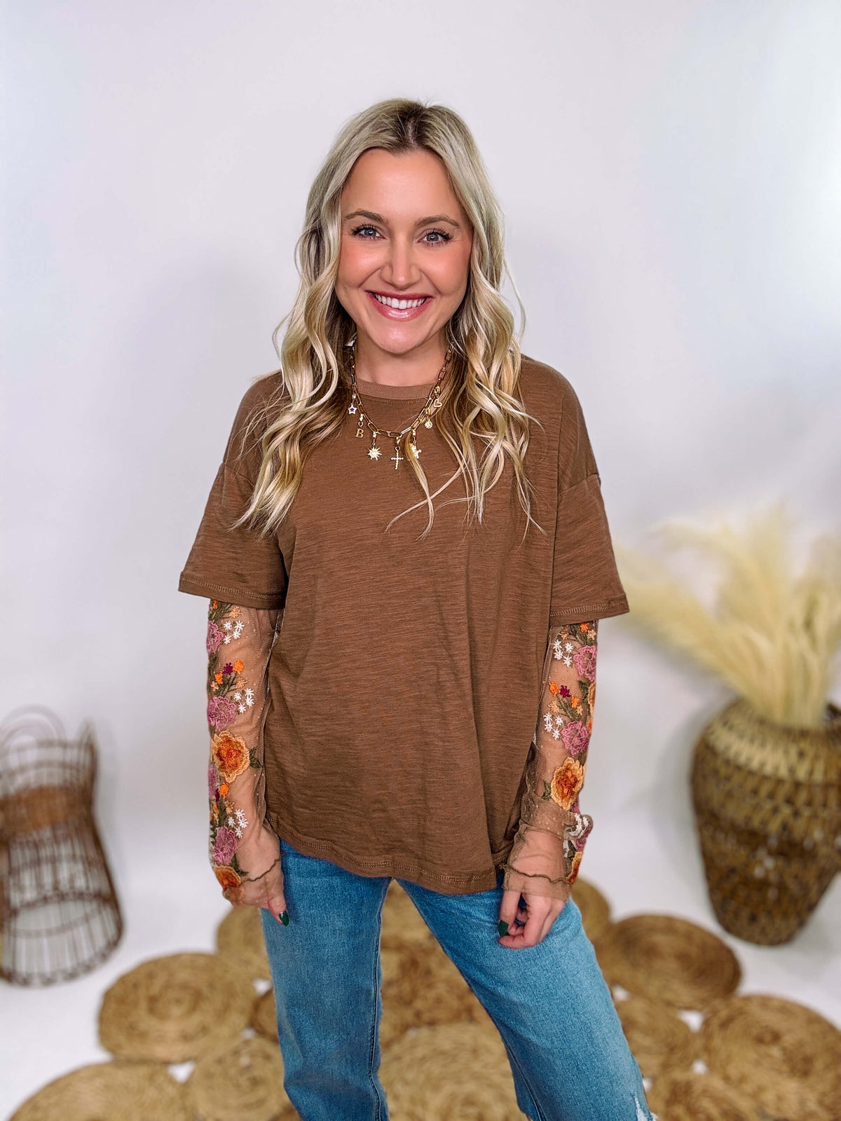 In Loom Mushroom Brown Oversized Tee with Layered Sheer Embroidered Floral Lace Mesh Sleeves – Relaxed Fit, Feminine Detailing, and Edgy Winter Style.