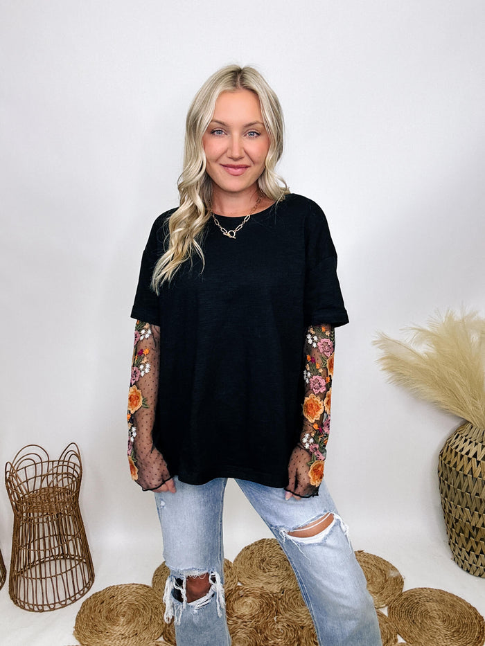 In Loom Oversized black tee with layered sheer embroidered floral lace mesh sleeves, perfect for fall with edgy vibes.