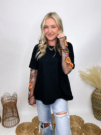 In Loom Oversized black tee with layered sheer embroidered floral lace mesh sleeves, perfect for fall with edgy vibes.