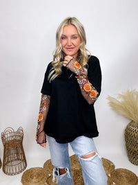 In Loom Oversized black tee with layered sheer embroidered floral lace mesh sleeves, perfect for fall with edgy vibes.