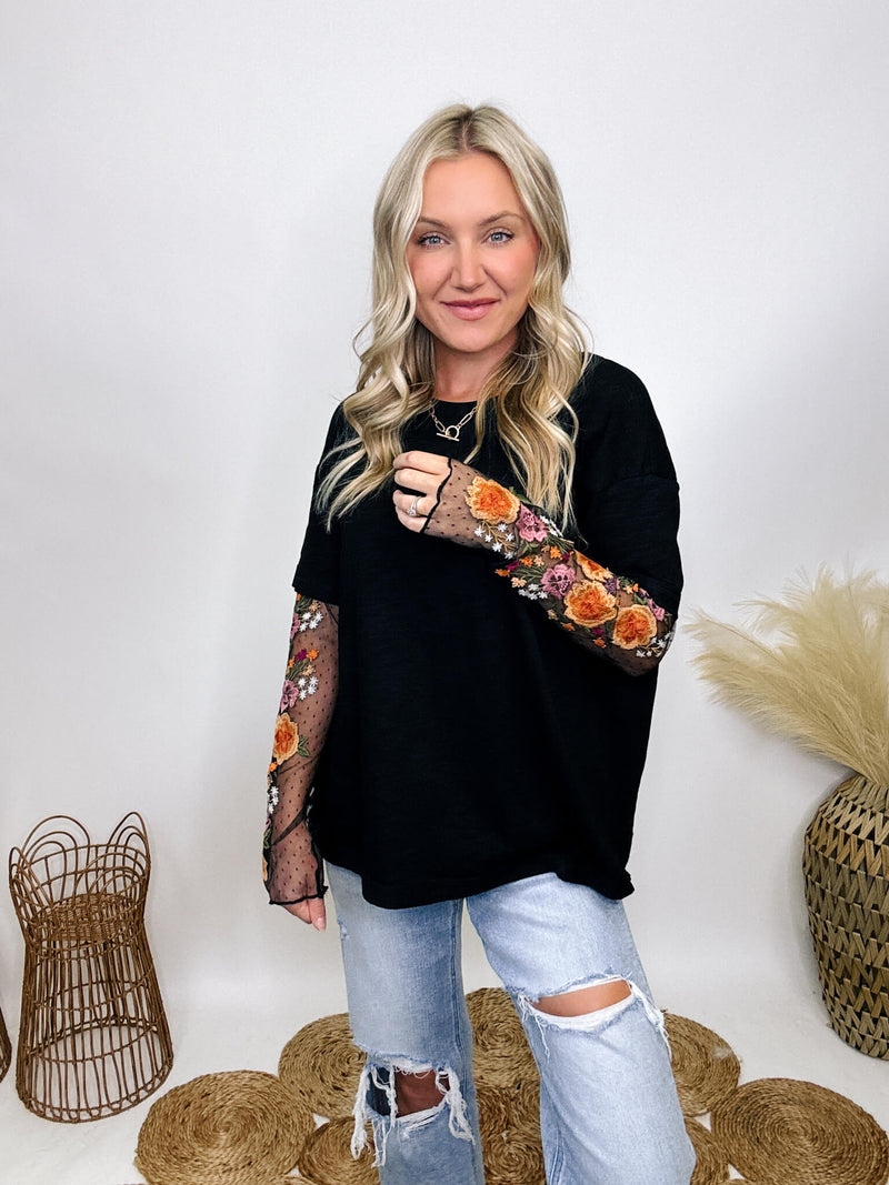 In Loom Oversized black tee with layered sheer embroidered floral lace mesh sleeves, perfect for fall with edgy vibes.