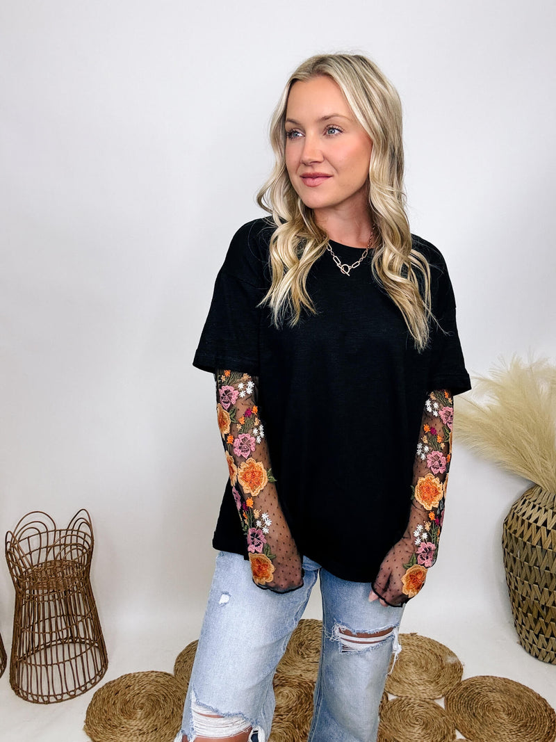 In Loom Oversized black tee with layered sheer embroidered floral lace mesh sleeves, perfect for fall with edgy vibes.