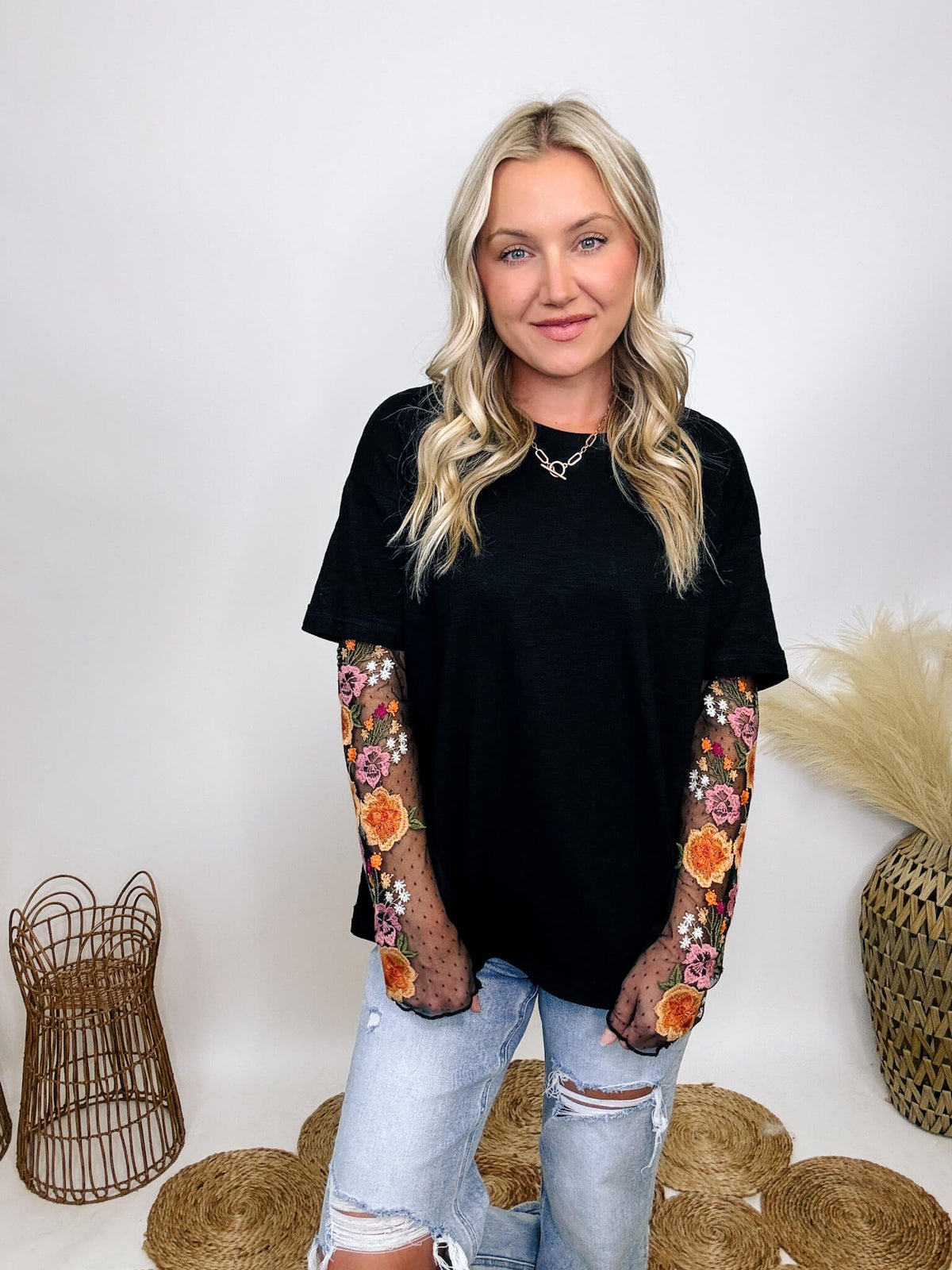 In Loom Oversized black tee with layered sheer embroidered floral lace mesh sleeves, perfect for fall with edgy vibes.