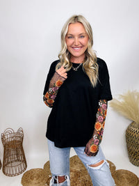 In Loom Oversized black tee with layered sheer embroidered floral lace mesh sleeves, perfect for fall with edgy vibes.