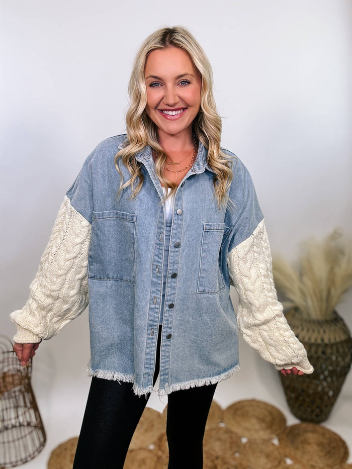 Light denim jacket with cream sweater sleeves by POL, featuring chest pockets, collared button-down front, and frayed hem.