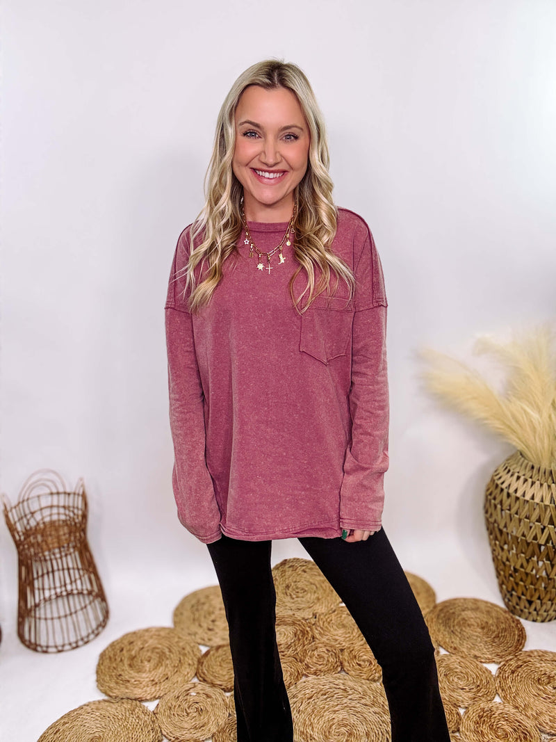 Mauve Acid Washed Long Sleeve Top with Raw Edge Detail, Chest Pocket, and Relaxed Fit – Perfect for Casual Outfits with Leggings and Sneakers.