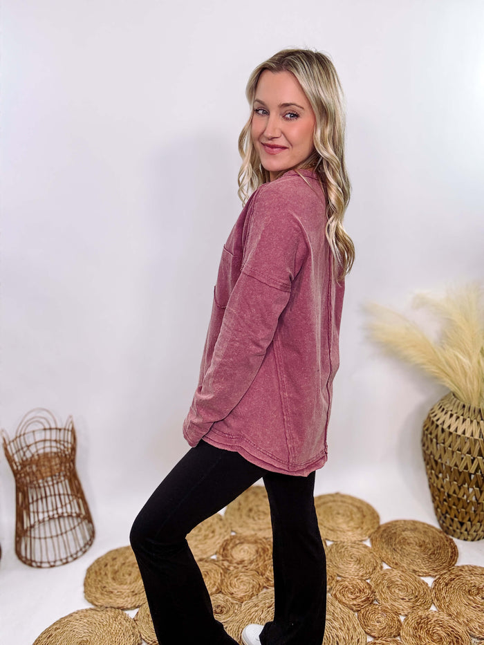 Mauve Acid Washed Long Sleeve Top with Raw Edge Detail, Chest Pocket, and Relaxed Fit – Perfect for Casual Outfits with Leggings and Sneakers.
