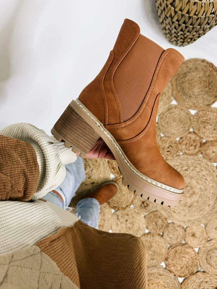 MIA Torren Boot in cognac, featuring a slip-on design with elastic stretchy tabs, platform sole, chunky stacked heel, and lug sole.
