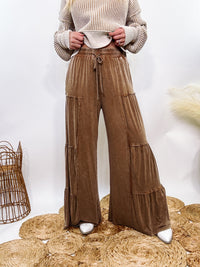 Brown Acid Washed Tiered Flared Wide Leg Boho Pants with Elastic Drawstring Waist, Side Pockets, and Comfortable 100% Cotton Fabric.

