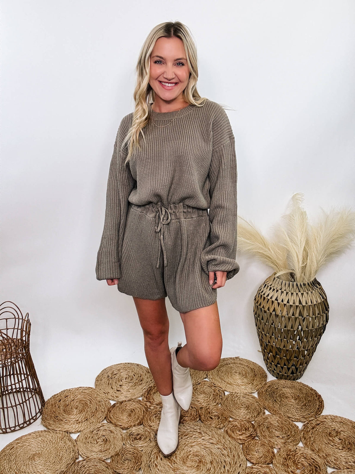 Mable Mushroom long sleeve sweater romper with drawstring waist, styled with knee-high boots, heels, or sneakers for fall