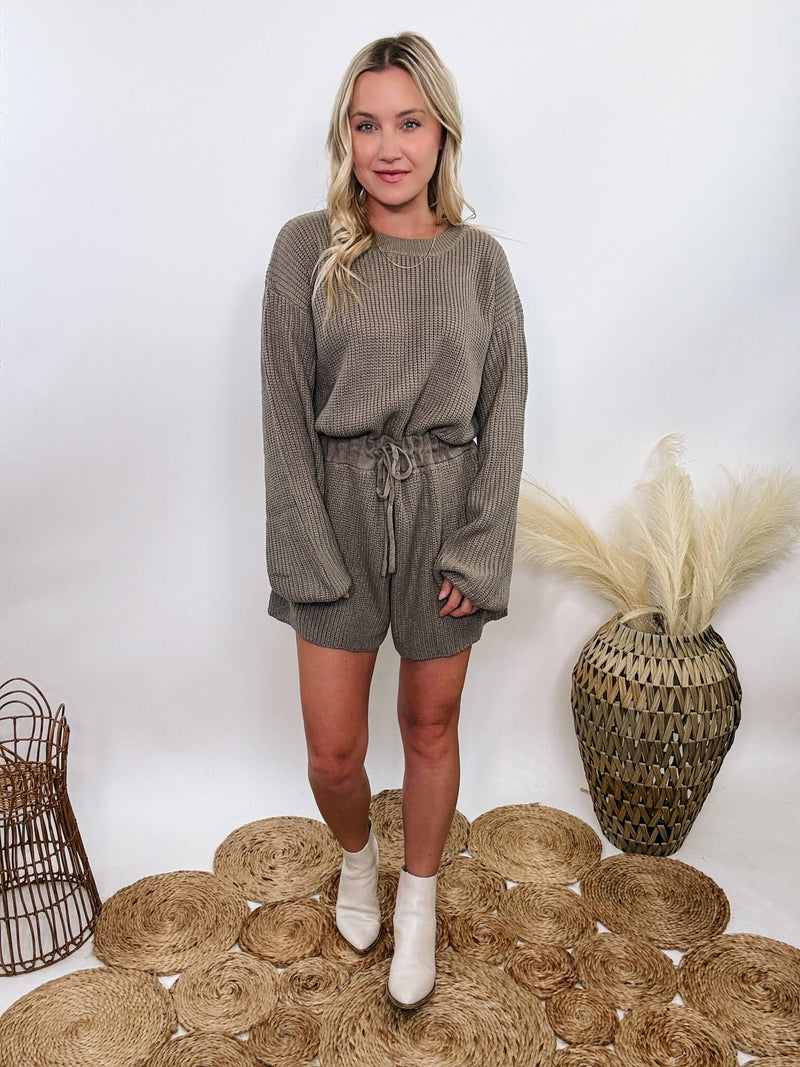 Mable Mushroom long sleeve sweater romper with drawstring waist, styled with knee-high boots, heels, or sneakers for fall