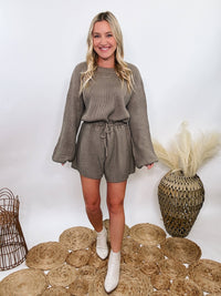 Mable Mushroom long sleeve sweater romper with drawstring waist, styled with knee-high boots, heels, or sneakers for fall