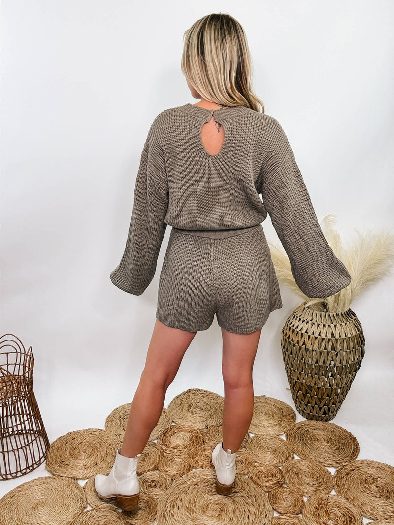 Mable Mushroom long sleeve sweater romper with drawstring waist, styled with knee-high boots, heels, or sneakers for fall