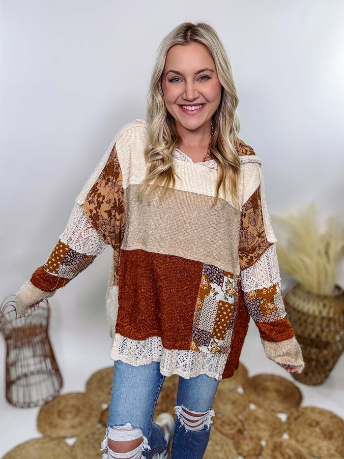 Boho patchwork oversized hoodie by Oli & Hali featuring lace and floral details in rust, tan, beige, and cream. Oversized fit with side pockets, made from high-quality materials including polyester, spandex, rayon, nylon, and cotton. Size down for a more tailored look. Perfect for pairing with leggings or dressing up with denim and booties.