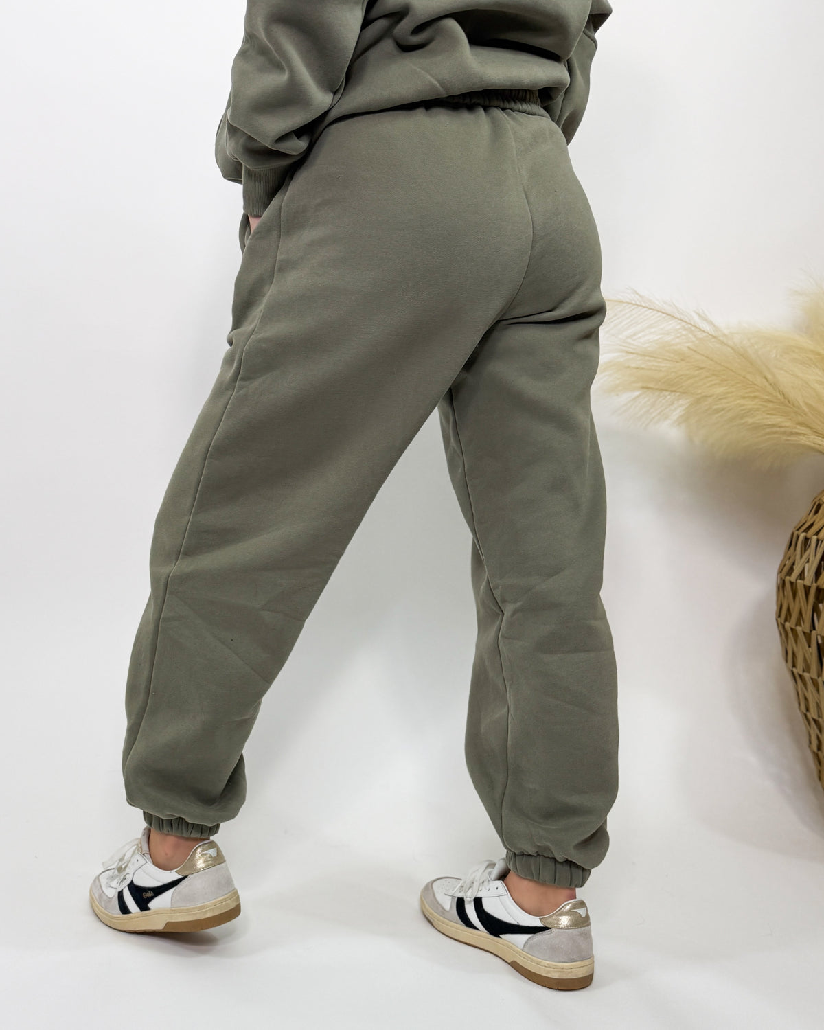 Olive green fleece-lined luxury lounge Bmaes joggers with elastic drawstring waistband, deep pockets, and elastic ankle cuffs. Perfect for lounging or pairing with the matching hoodie for a stylish, cozy set from Bmaes Boutique.