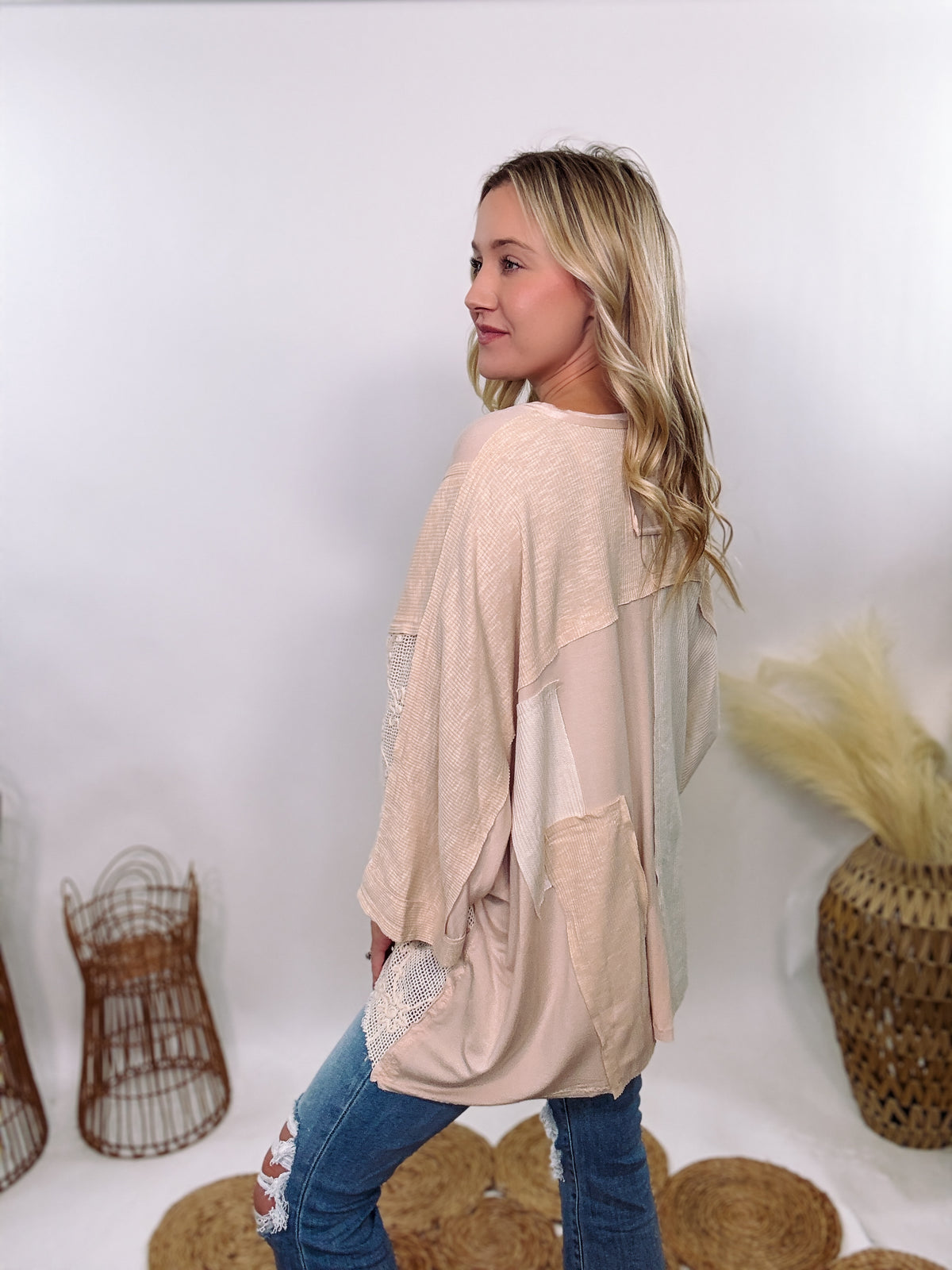 POL Neutral Cream Mix Short Sleeve V-Neck Oversized Knit Top with crochet and thermal patchwork, frayed edges, and exposed seams for a comfy, boho chic look.