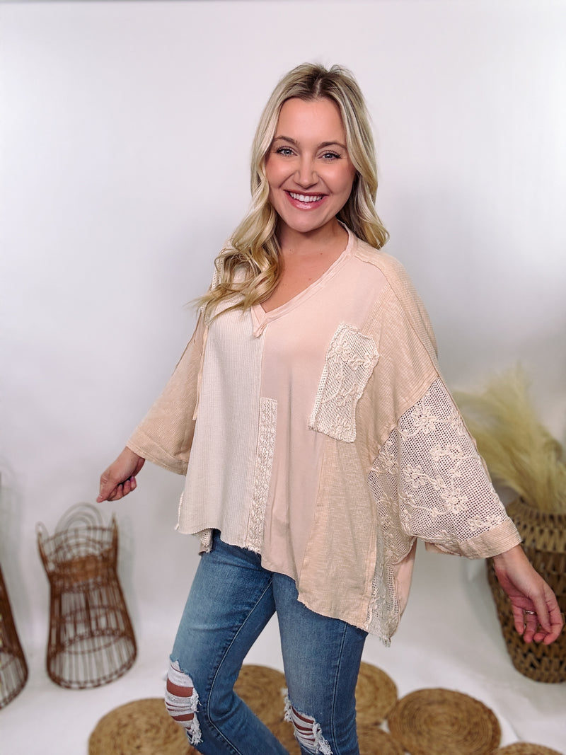 POL Neutral Cream Mix Short Sleeve V-Neck Oversized Knit Top with crochet and thermal patchwork, frayed edges, and exposed seams for a comfy, boho chic look.