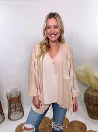 POL Neutral Cream Mix Short Sleeve V-Neck Oversized Knit Top with crochet and thermal patchwork, frayed edges, and exposed seams for a comfy, boho chic look.