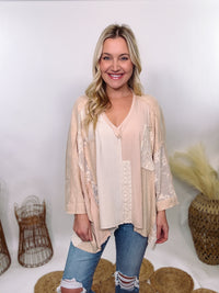 POL Neutral Cream Mix Short Sleeve V-Neck Oversized Knit Top with crochet and thermal patchwork, frayed edges, and exposed seams for a comfy, boho chic look.