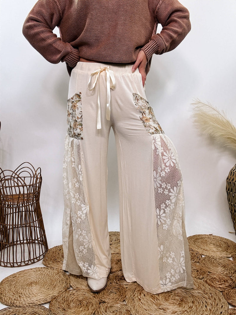 POL Lace and Floral Wide Leg Boho Pants in cream with floral accents and lace details.