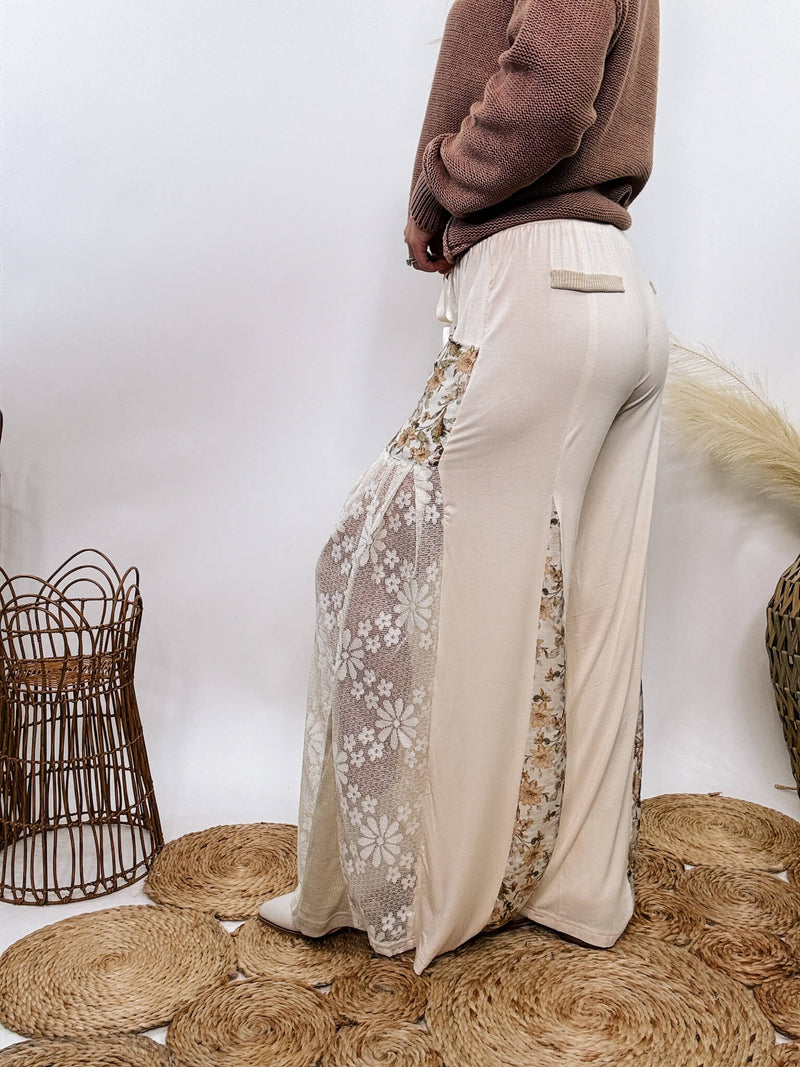 POL Lace and Floral Wide Leg Boho Pants in cream with floral accents and lace details.