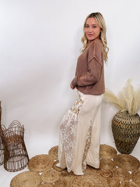 POL Lace and Floral Wide Leg Boho Pants in cream with floral accents and lace details.