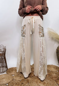 POL Lace and Floral Wide Leg Boho Pants in cream with floral accents and lace details.