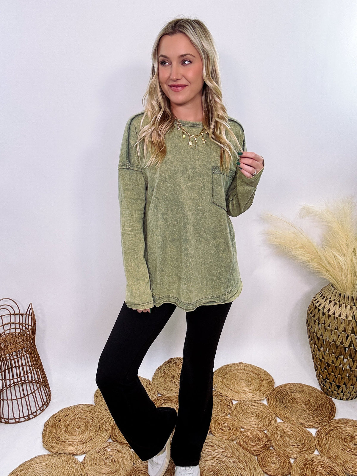 Sage Green Acid Washed Long Sleeve Top with Raw Edge Detail, Chest Pocket, and Relaxed Fit – Perfect for Casual Outfits with Leggings and Sneakers.