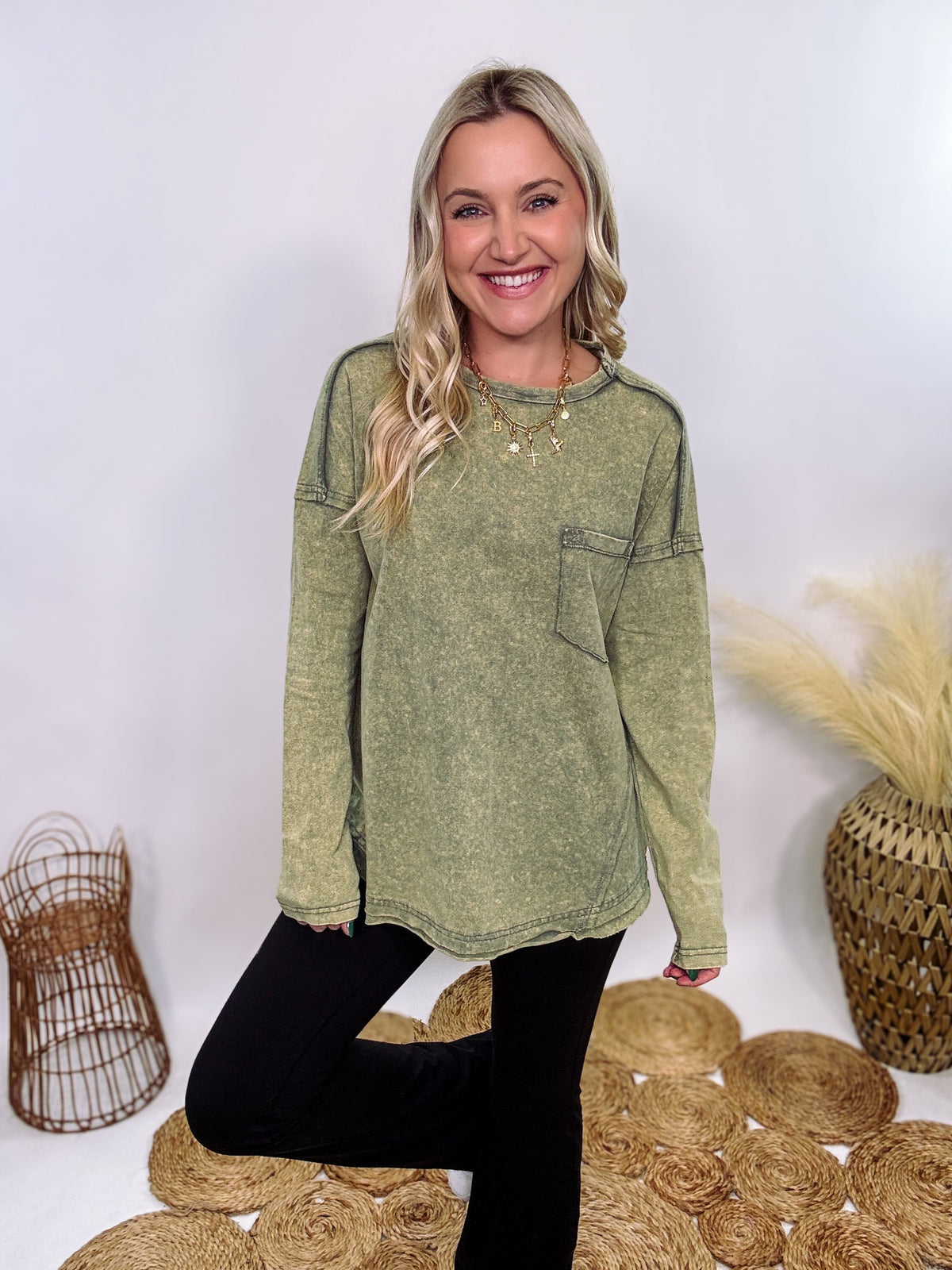 Sage Green Acid Washed Long Sleeve Top with Raw Edge Detail, Chest Pocket, and Relaxed Fit – Perfect for Casual Outfits with Leggings and Sneakers.