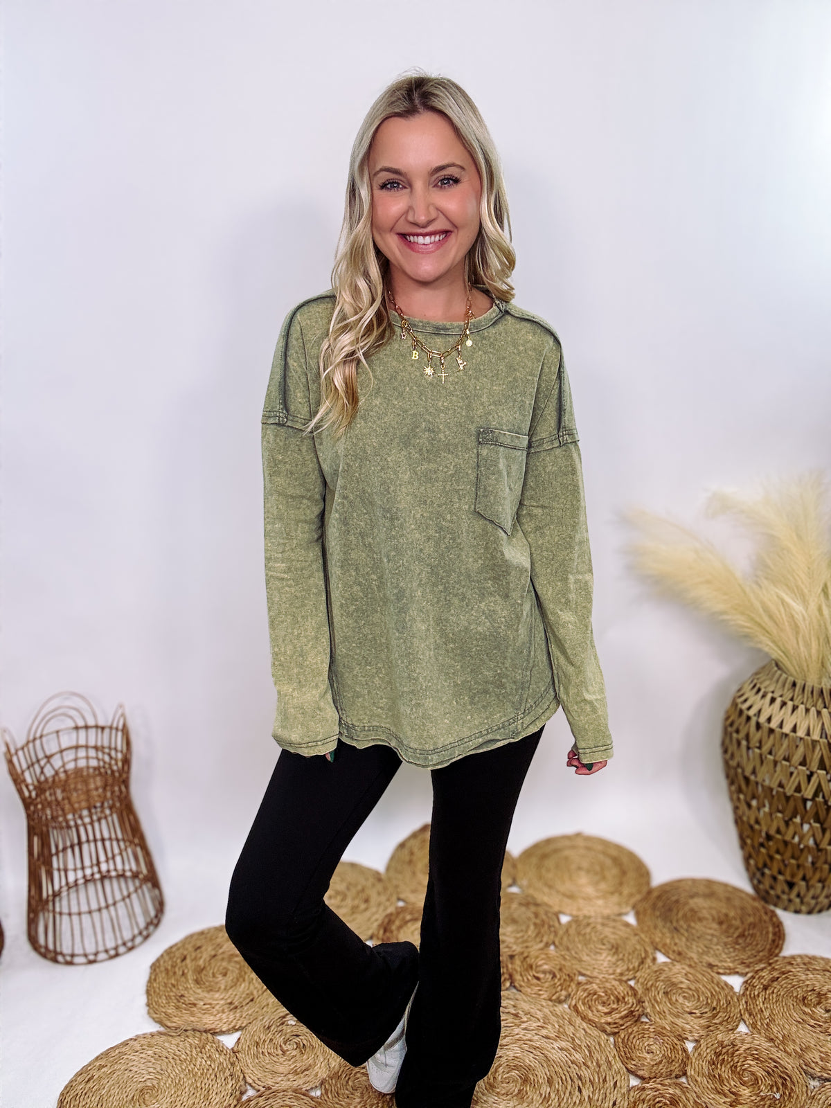 Sage Green Acid Washed Long Sleeve Top with Raw Edge Detail, Chest Pocket, and Relaxed Fit – Perfect for Casual Outfits with Leggings and Sneakers.