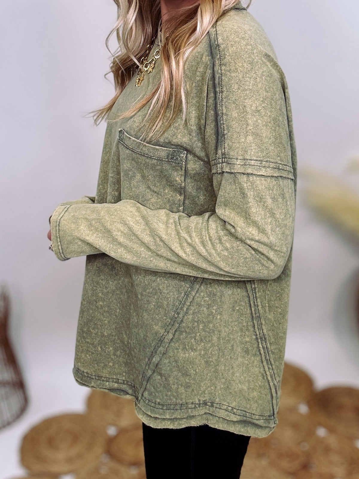 Sage Green Acid Washed Long Sleeve Top with Raw Edge Detail, Chest Pocket, and Relaxed Fit – Perfect for Casual Outfits with Leggings and Sneakers.