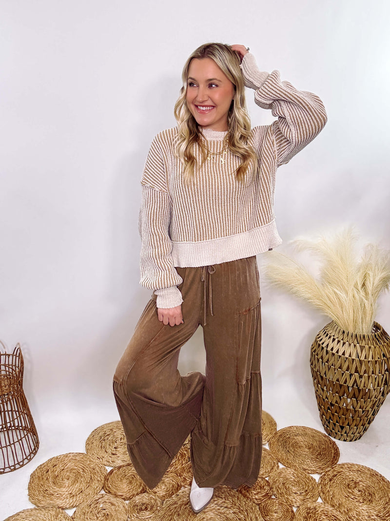 Very J Two-tone neutral ribbed sweater featuring a cream body with light brown ribbed detailing, round neck, and loose fit. Made from 100% polyester with a soft, non-scratchy feel. Styled with a neutral beanie and kick flare denim for a cozy winter look.