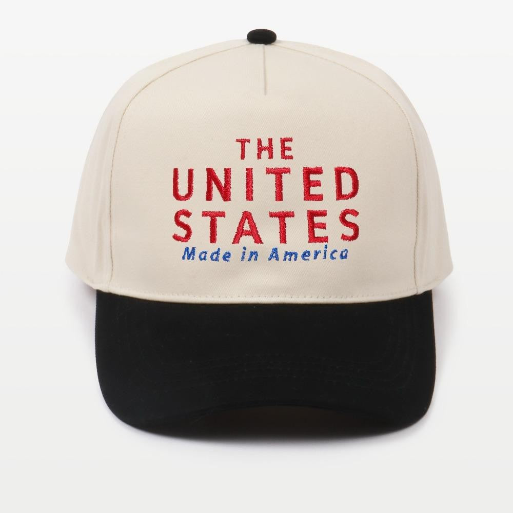 Two-tone baseball cap embroidered with "THE UNITED STATES Made In America" in bold lettering, featuring a snapback closure.