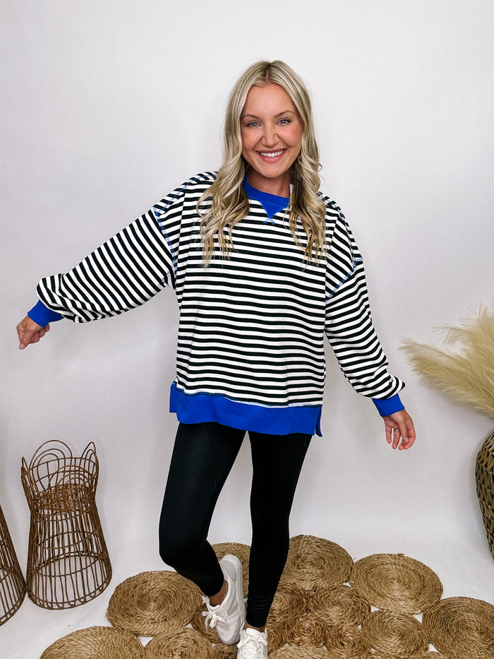 Very J Black, white, and blue striped crewneck pullover with side slits and relaxed fit.