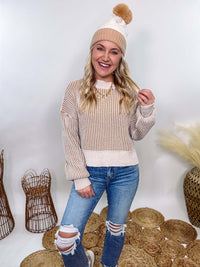 Very J Two-tone neutral ribbed sweater featuring a cream body with light brown ribbed detailing, round neck, and loose fit. Made from 100% polyester with a soft, non-scratchy feel. Styled with a neutral beanie and kick flare denim for a cozy winter look.