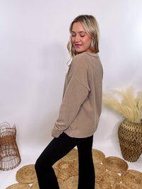 Washed Brown Oversized Ribbed Long Sleeve Top with Soft Texture and Exposed Stitch Details – Cozy and Stylish Layering Piece for Fall and Winter. Perfect for Casual Outfits, Lounging, or Pairing with Jackets.