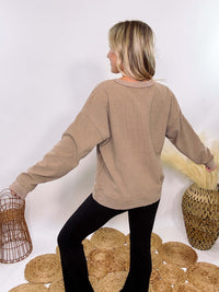 Washed Brown Oversized Ribbed Long Sleeve Top with Soft Texture and Exposed Stitch Details – Cozy and Stylish Layering Piece for Fall and Winter. Perfect for Casual Outfits, Lounging, or Pairing with Jackets.