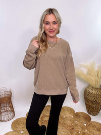 Washed Brown Oversized Ribbed Long Sleeve Top with Soft Texture and Exposed Stitch Details – Cozy and Stylish Layering Piece for Fall and Winter. Perfect for Casual Outfits, Lounging, or Pairing with Jackets.