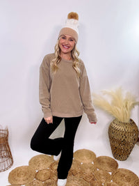 Washed Brown Oversized Ribbed Long Sleeve Top with Soft Texture and Exposed Stitch Details – Cozy and Stylish Layering Piece for Fall and Winter. Perfect for Casual Outfits, Lounging, or Pairing with Jackets.