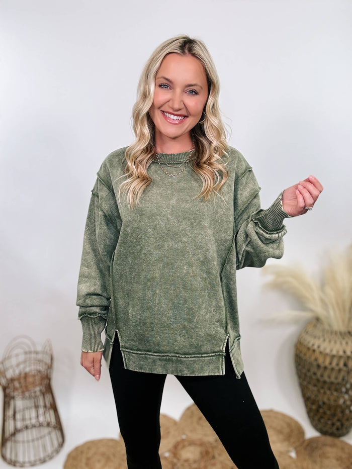 Zenana Green acid washed fleece sweatshirt pullover with exposed seams and side slits, featuring a relaxed fit