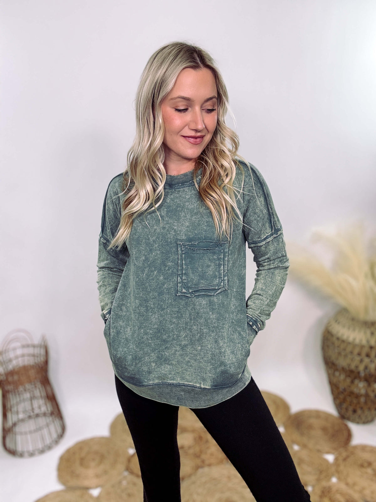 Zenana Ash Jade Green Acid Washed Raw Hem Pocket Pullover with raw edge seams, chest and side pockets, ribbed wrist and hem detailing, and a cozy relaxed fit.